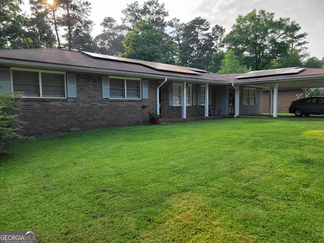 4157 Cedar Valley Ln, Conley, GA 30288 - single story home with a front yard, roof mounted solar panels, covered porch, and brick siding