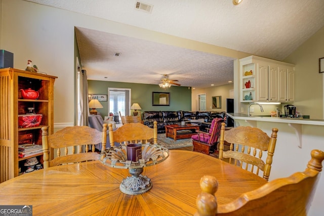 637 Lakeview Dr, Newborn, GA 30056 - dining space featuring a textured ceiling and a ceiling fan