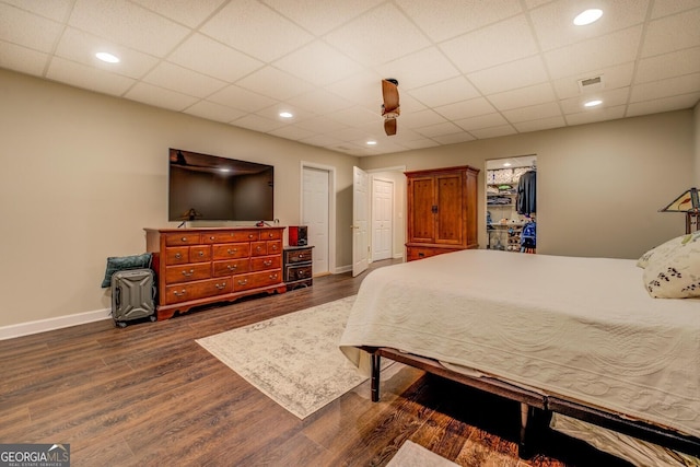 637 Lakeview Dr, Newborn, GA 30056 - bedroom featuring dark wood-style floors, a ceiling fan, and a paneled ceiling
