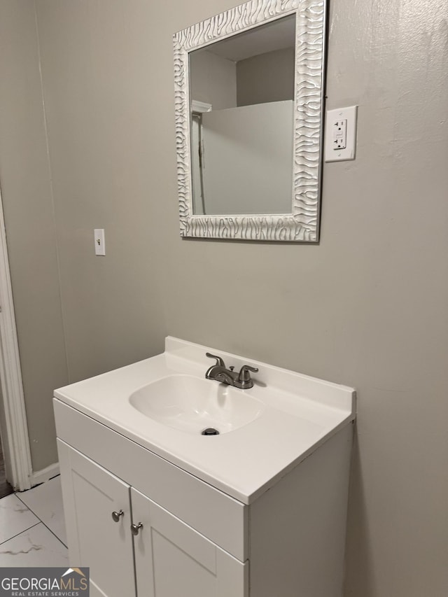 225 Bell St, Covington, GA 30016 - bathroom featuring marble finish flooring and vanity
