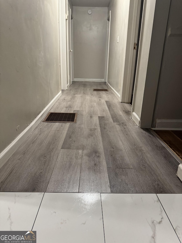 225 Bell St, Covington, GA 30016 - corridor with wood finished floors and baseboards