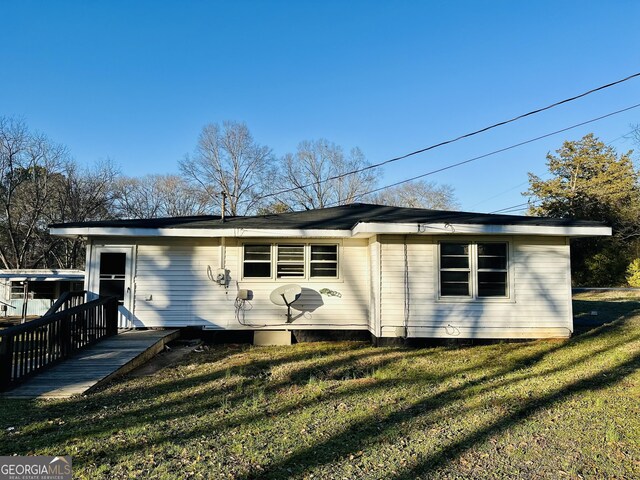 225 Bell St, Covington, GA 30016 - back of house featuring a lawn