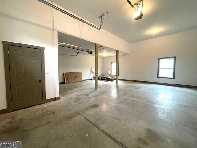400 Mulberry Cir, Jasper, GA 30143 - garage featuring a garage door opener and baseboards