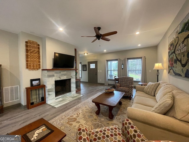 400 Mulberry Cir, Jasper, GA 30143 - living room featuring a stone fireplace, ceiling fan, wood finished floors, and recessed lighting