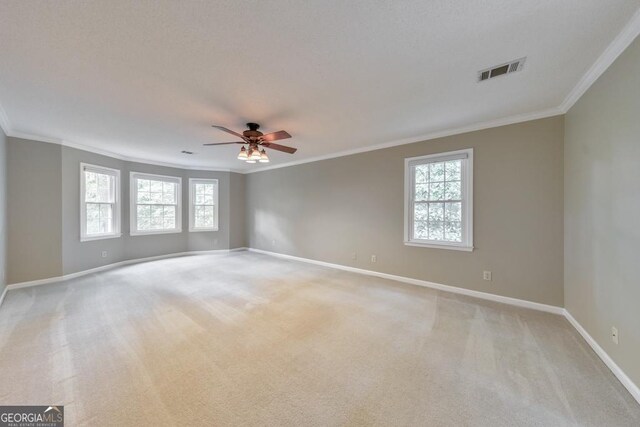 405 W Leslie Ct, Woodstock, GA 30188 - spare room featuring crown molding, ceiling fan, light colored carpet, and plenty of natural light