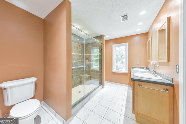 405 W Leslie Ct, Woodstock, GA 30188 - bathroom with double vanity, a stall shower, tile patterned flooring, recessed lighting, and a textured ceiling