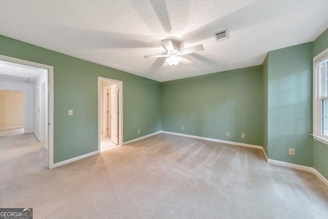 405 W Leslie Ct, Woodstock, GA 30188 - unfurnished bedroom with attic access, carpet, a textured ceiling, and a ceiling fan