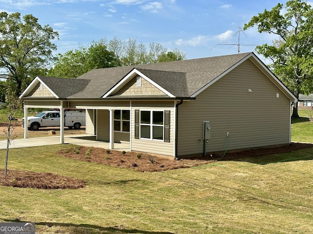 278 Stancil Dr, Toccoa, GA 30577 - view of home's exterior with a shingled roof, driveway, an attached carport, and a lawn