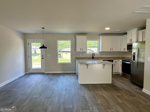 278 Stancil Dr, Toccoa, GA 30577 - kitchen featuring stainless steel appliances, a kitchen island, white cabinetry, dark wood-style flooring, and recessed lighting