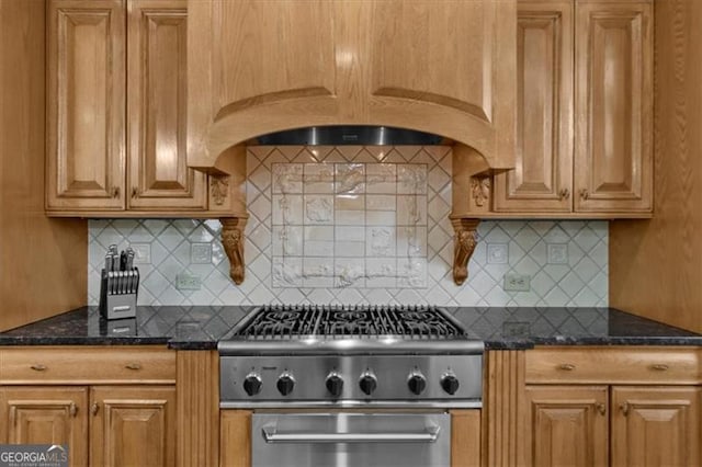 9005 Old Southwick Pass, Alpharetta, GA 30022 - kitchen with range, backsplash, and dark stone countertops