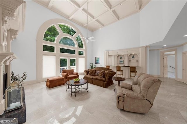 9005 Old Southwick Pass, Alpharetta, GA 30022 - living area with coffered ceiling, a towering ceiling, ceiling fan, and beamed ceiling