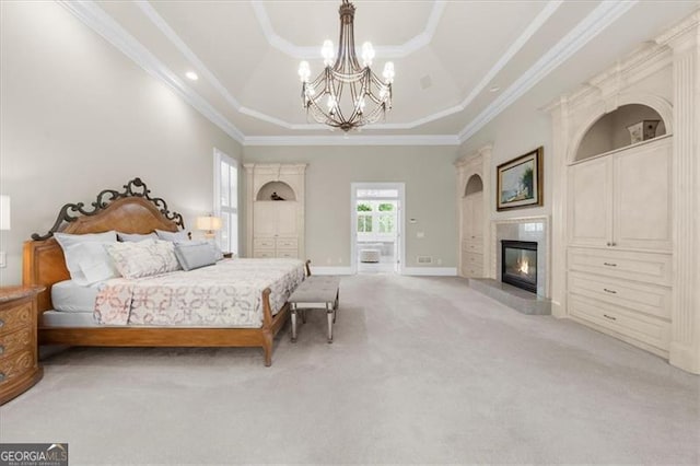9005 Old Southwick Pass, Alpharetta, GA 30022 - bedroom with a tray ceiling, light colored carpet, a chandelier, a glass covered fireplace, and ornamental molding