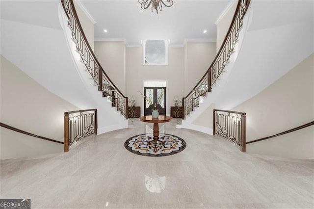 9005 Old Southwick Pass, Alpharetta, GA 30022 - entryway with crown molding, stairway, a chandelier, a high ceiling, and recessed lighting