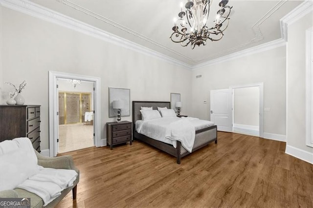 9005 Old Southwick Pass, Alpharetta, GA 30022 - bedroom with a chandelier, wood finished floors, and ornamental molding