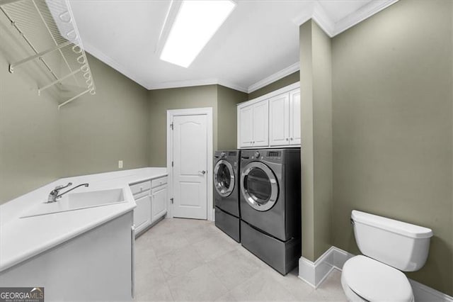 9005 Old Southwick Pass, Alpharetta, GA 30022 - laundry area featuring independent washer and dryer, crown molding, and cabinet space