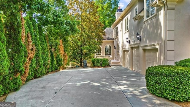 9005 Old Southwick Pass, Alpharetta, GA 30022 - view of community with a garage and driveway