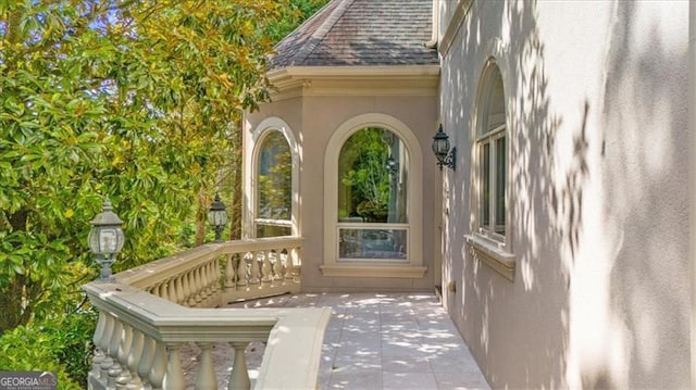 9005 Old Southwick Pass, Alpharetta, GA 30022 - property entrance with roof with shingles and stucco siding
