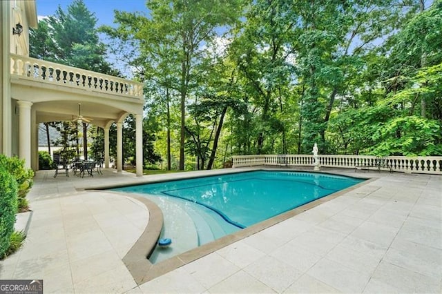 9005 Old Southwick Pass, Alpharetta, GA 30022 - swimming pool featuring a patio area and view of wooded area