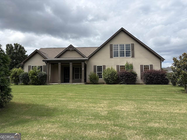 309 Ron Dr, Bethlehem, GA 30620 - view of front of house with a front lawn