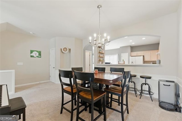 771 Tulip Poplar, Lawrenceville, GA 30044 - dining area featuring light colored carpet, arched walkways, a chandelier, and recessed lighting