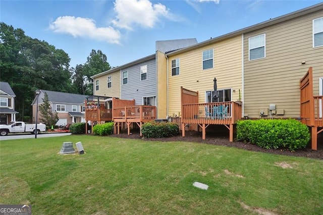 771 Tulip Poplar, Lawrenceville, GA 30044 - back of house with a wooden deck, a yard, and a residential view