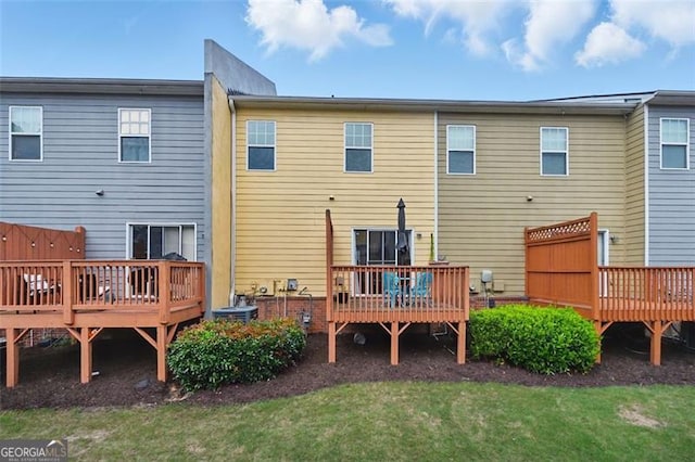 771 Tulip Poplar, Lawrenceville, GA 30044 - back of property featuring a wooden deck and a yard