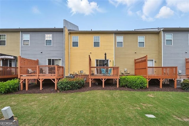 771 Tulip Poplar, Lawrenceville, GA 30044 - rear view of house featuring a wooden deck and a yard