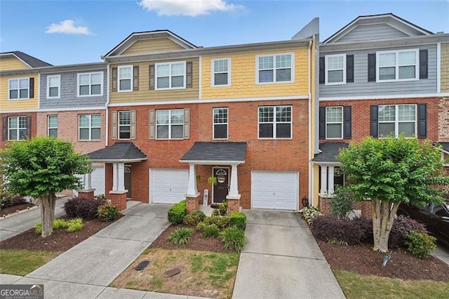 771 Tulip Poplar, Lawrenceville, GA 30044 - view of property featuring driveway, a garage, and brick siding