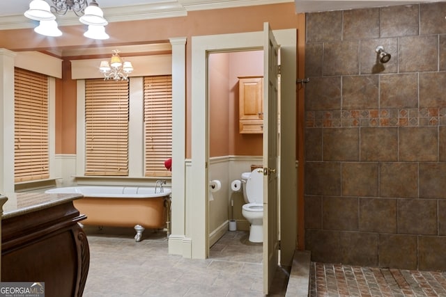 627 E Broughton St, Bainbridge, GA 39817 - full bathroom with a chandelier, crown molding, toilet, a freestanding tub, and vanity