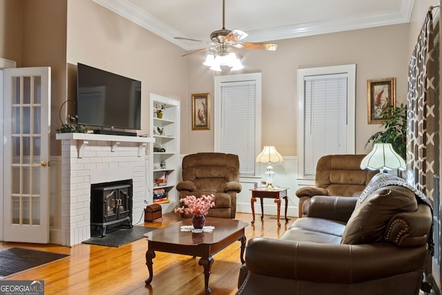 627 E Broughton St, Bainbridge, GA 39817 - living room with crown molding, ceiling fan, built in shelves, and wood finished floors