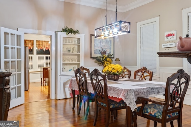 627 E Broughton St, Bainbridge, GA 39817 - dining space with a chandelier, crown molding, and wood finished floors