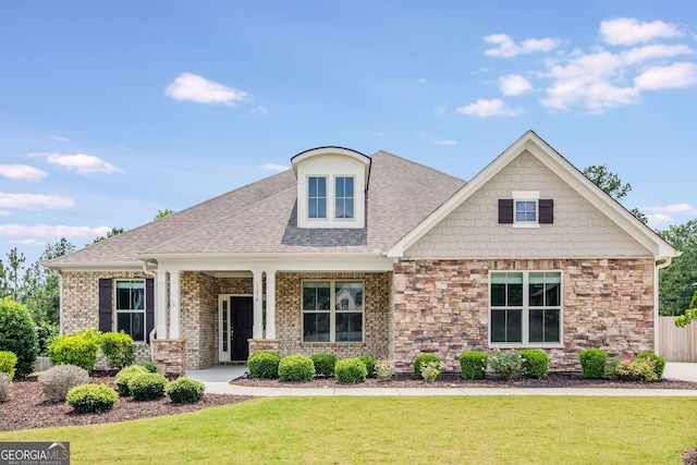 1374 Highland Wood Ct, Auburn, GA 30011 - craftsman-style home featuring a front yard, stone siding, and roof with shingles