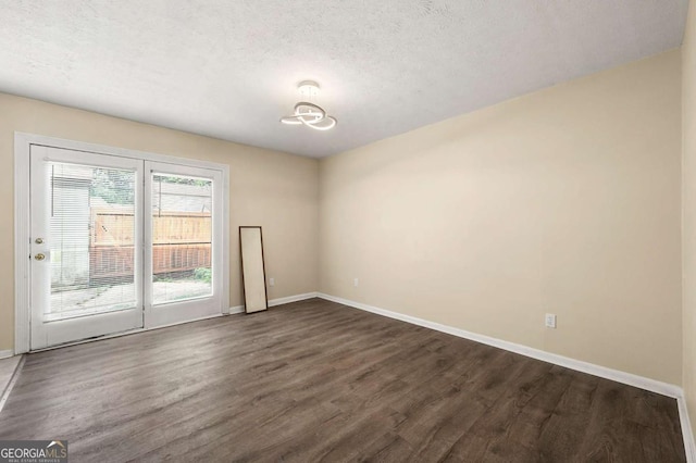 3184 Nectarine Cir, Decatur, GA 30034 - empty room with dark wood-style floors and a textured ceiling