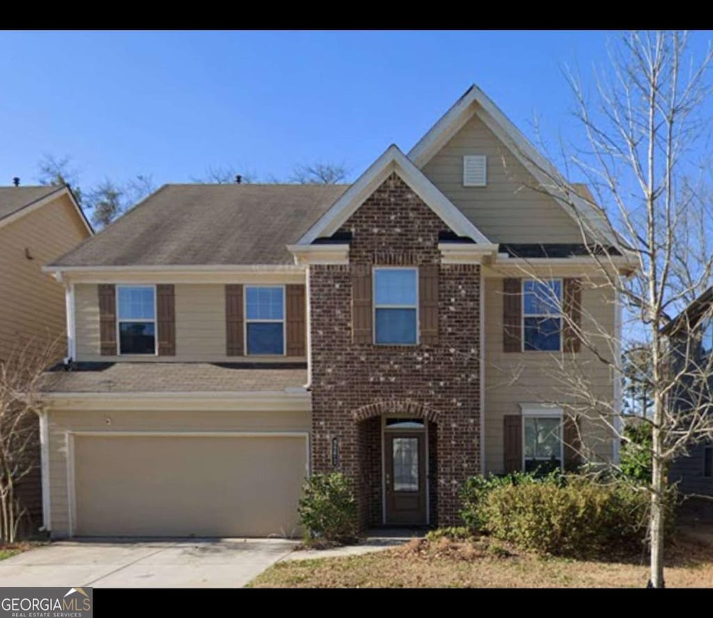 3272 Baylor Cir, Mcdonough, GA 30253 - view of front of home with an attached garage, concrete driveway, and brick siding
