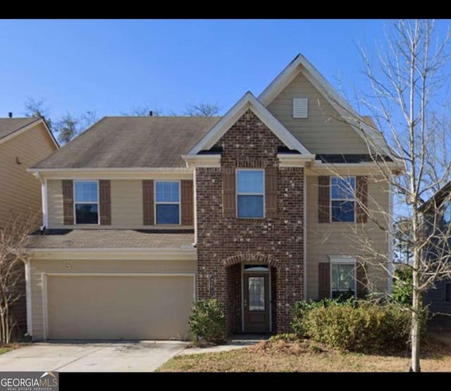 3272 Baylor Cir, Mcdonough, GA 30253 - view of front of home with an attached garage, concrete driveway, and brick siding