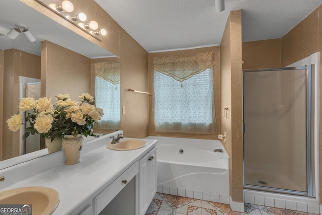 4969 Truitt Ln, Decatur, GA 30035 - bathroom with a shower stall, a garden tub, double vanity, a textured ceiling, and plenty of natural light