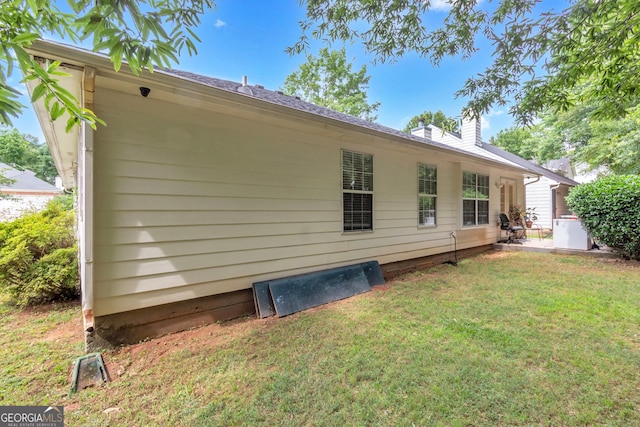 4969 Truitt Ln, Decatur, GA 30035 - back of house with a yard and a chimney