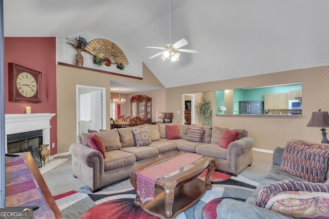 4969 Truitt Ln, Decatur, GA 30035 - living room with wallpapered walls, a chandelier, a ceiling fan, light carpet, and a fireplace