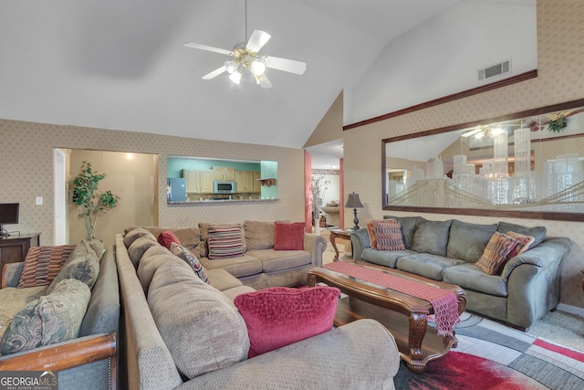 4969 Truitt Ln, Decatur, GA 30035 - living room featuring wallpapered walls, ceiling fan, vaulted ceiling, and carpet flooring
