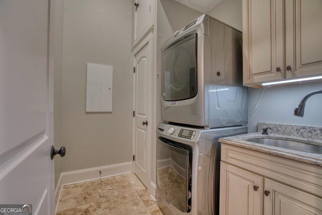 1 E 3rd Ave Unit 401, Rome, GA 30161 - washroom with stacked washer / dryer and cabinet space