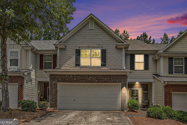 461 Mountain View Ln, Woodstock, GA 30188 - view of property featuring concrete driveway, brick siding, and a garage
