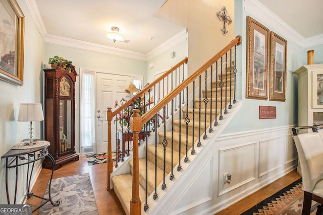 461 Mountain View Ln, Woodstock, GA 30188 - foyer featuring ornamental molding, wood finished floors, stairway, and wainscoting