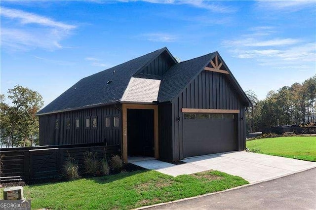 130 Marina Parc Dr, Waleska, GA 30183 - view of front of home with board and batten siding, concrete driveway, roof with shingles, and a garage