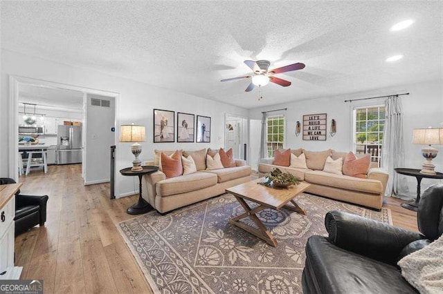 150 Kensley Way, Dallas, GA 30157 - living area featuring ceiling fan, light wood-style floors, a textured ceiling, and recessed lighting