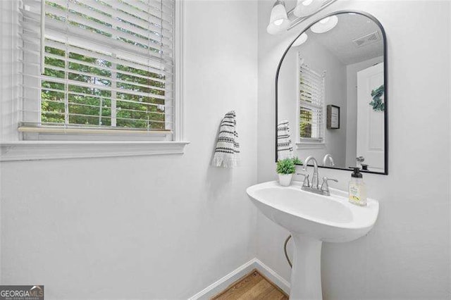 150 Kensley Way, Dallas, GA 30157 - bathroom featuring baseboards and wood finished floors