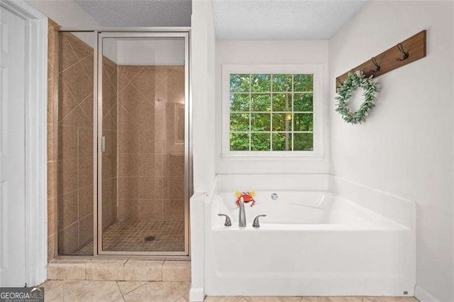 150 Kensley Way, Dallas, GA 30157 - full bath featuring a garden tub, a stall shower, a textured ceiling, and tile patterned floors