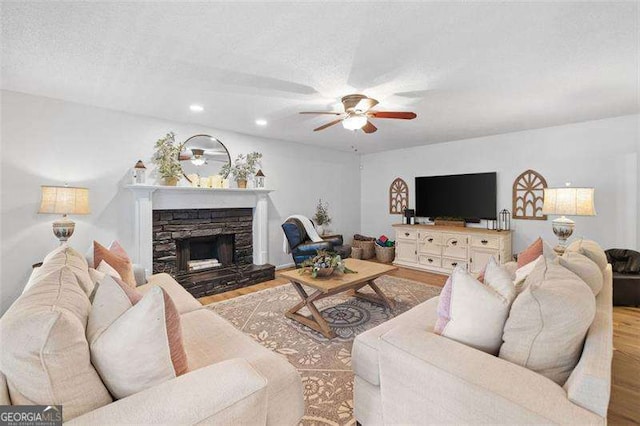 150 Kensley Way, Dallas, GA 30157 - living room with ceiling fan, wood finished floors, recessed lighting, and a stone fireplace