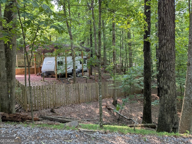 336 6th St, Ellijay, GA 30540 - view of yard featuring a forest view, an outdoor structure, and exterior structure
