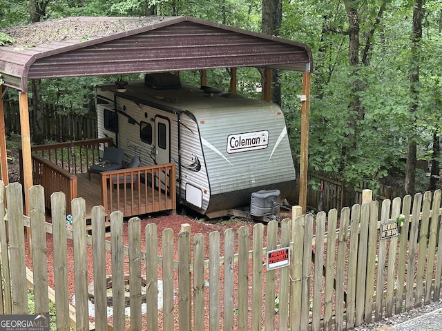336 6th St, Ellijay, GA 30540 - view of front facade with a carport and a wooden deck