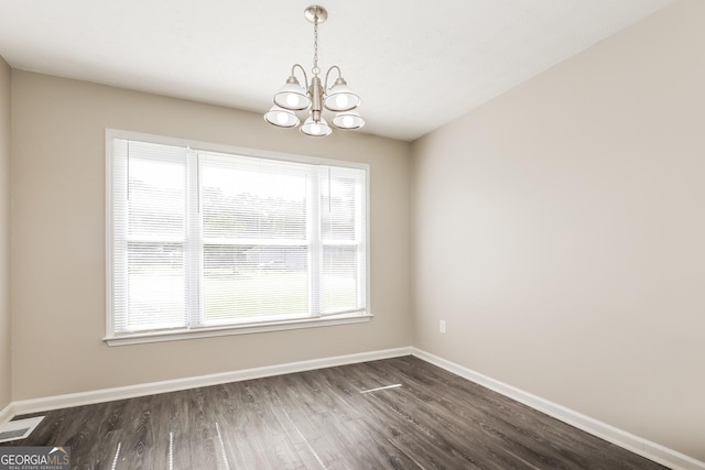11102 Hunters Ln, Hampton, GA 30228 - unfurnished dining area with a chandelier, healthy amount of natural light, and dark wood-type flooring